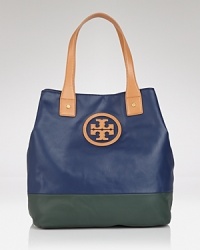 Take this season's color block trend with you anywhere and fill it with everything. This dipped canvas tote from Tory Burch flaunts practical style, sturdy trims, and a must-have mixed media finish. Take this season's color block trend with you anywhere and fill it with everything. This dipped canvas tote from Tory Burch flaunts practical style, sturdy trims, and a must-have mixed media finish.