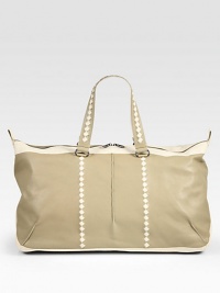 A classic duffel shape stylishly crafted in smooth calfskin leather with woven trim detail.Zip closureTop handleAdjustable shoulder strapInterior zip pocketFully lined22¾W x 11¾H x 11DMade in Italy A classic duffel shape stylishly crafted in smooth calfskin leather with woven trim detail.Zip closureTop handleAdjustable shoulder strapInterior zip pocketFully lined22¾W x 11¾H x 11DMade in Italy
