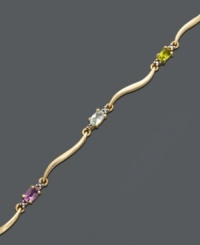 Let waves of sparkling color wash over your wrist. This multi stone bracelet features oval-cut white topaz (1/6 ct. t.w.), citrine (1/6 ct. t.w.), African amethyst (1/6 ct. t.w.), blue topaz (1/5 ct. t.w.), garnet (1/4 ct. t.w.), peridot (1/5 ct. t.w.) and diamond accents. Crafted in 18k gold over sterling silver. Approximate length: 7-1/4 inches. Let waves of sparkling color wash over your wrist. This multi stone bracelet features oval-cut white topaz (1/6 ct. t.w.), citrine (1/6 ct. t.w.), African amethyst (1/6 ct. t.w.), blue topaz (1/5 ct. t.w.), garnet (1/4 ct. t.w.), peridot (1/5 ct. t.w.) and diamond accents. Crafted in 18k gold over sterling silver. Approximate length: 7-1/4 inches.