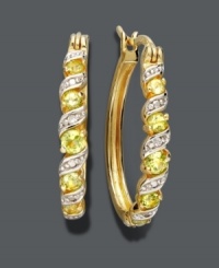 Brighten your day -- and your look! Victoria Townsend earrings feature luminous peridot gemstones (5/8 ct. t.w.) accented by sparkling diamonds in an 18k gold over sterling silver hoop setting. Approximate diameter: 1 inch. Brighten your day -- and your look! Victoria Townsend earrings feature luminous peridot gemstones (5/8 ct. t.w.) accented by sparkling diamonds in an 18k gold over sterling silver hoop setting. Approximate diameter: 1 inch.