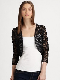 A classic bolero silhouette, dressed up with ribbon embroidery and studded with matching rosettes.Three-quarter sleevesAbout 14 from shoulder to hemPolyesterImportedDry clean A classic bolero silhouette, dressed up with ribbon embroidery and studded with matching rosettes.Three-quarter sleevesAbout 14 from shoulder to hemPolyesterImportedDry clean