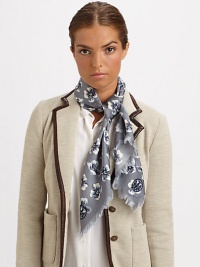 A charming floral print and zig-zag fringe add unique style to a wool scarf.WoolAbout 45 X 45Dry cleanImported