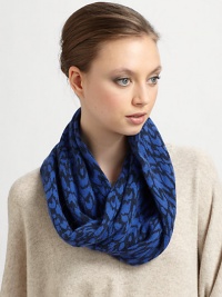 Ultra-soft in an animal printed plush wool and angora blend for supreme warmth and style.Merino Wool/Angora/Nylon14.5W X 12.5L X 13.5DDry cleanImported Ultra-soft in an animal printed plush wool and angora blend for supreme warmth and style.Merino Wool/Angora/Nylon14.5W X 12.5L X 13.5DDry cleanImported