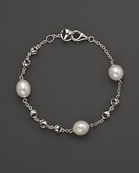 A bold sterling silver and freshwater pearl chain bracelet. By Di MODOLO. A bold sterling silver and freshwater pearl chain bracelet. By Di MODOLO.
