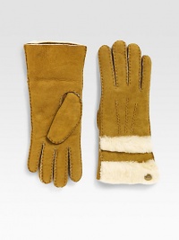 Cozy shearling lined sheepskin with top-stitch detailing is both fashion forward and functional with added sheepskin layers on top. Metal logo button detail About 11 long Specialist dry clean Imported Fur origin: Spain Cozy shearling lined sheepskin with top-stitch detailing is both fashion forward and functional with added sheepskin layers on top. Metal logo button detail About 11 long Specialist dry clean Imported Fur origin: Spain