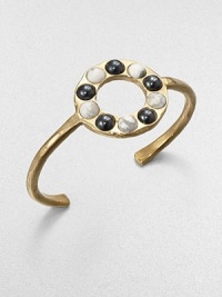 From the Cabochon Collection. A slender yet bold cuff is dotted with a circle of cabochon stones, some with a gunmetal finish, some with natural veining, all adding impact to this sophisticated design.Natural stone18k goldplatedDiameter, about 2.25Made in USA From the Cabochon Collection. A slender yet bold cuff is dotted with a circle of cabochon stones, some with a gunmetal finish, some with natural veining, all adding impact to this sophisticated design.Natural stone18k goldplatedDiameter, about 2.25Made in USA