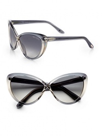 Striking cat's-eye design with a twisted bridge and logo-engraved lens in cool acetate. Available in shiny black with grey gradient lens or shiny blue with grey gradient lens.Logo temples100% UV protectionMade in Italy Striking cat's-eye design with a twisted bridge and logo-engraved lens in cool acetate. Available in shiny black with grey gradient lens or shiny blue with grey gradient lens.Logo temples100% UV protectionMade in Italy