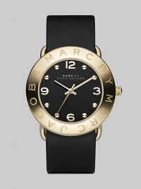 Streamlined timekeeping with a polished goldplated finish and fine leather strap.Quartz movement Water resistant to 3 ATM IP (ionic plated) gold bezel with engraved logo Stainless steel round case, 36mm, (1.42) Black dial IP gold numeral and hour markers Leather strap, 20mm, (.79) Imported 