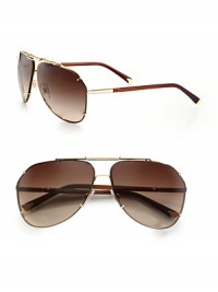This aviator style exudes effortless cool, crafted in lightweight metal with grommet detail. Available in gold frames with brown lenses.Metal100% UV ProtectionMade in Italy This aviator style exudes effortless cool, crafted in lightweight metal with grommet detail. Available in gold frames with brown lenses.Metal100% UV ProtectionMade in Italy
