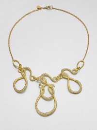 From the Elements Siyabona Collection. A modern melange of swirling loops and squiggles, in textured goldtone set with tiny Swarovski crystals for a subtle shimmer, hanging from a delicate golden chain.CrystalGoldtoneLength, about 18Lobster claspMade in USA From the Elements Siyabona Collection. A modern melange of swirling loops and squiggles, in textured goldtone set with tiny Swarovski crystals for a subtle shimmer, hanging from a delicate golden chain.CrystalGoldtoneLength, about 18Lobster claspMade in USA