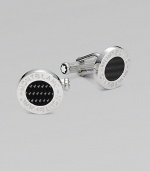 Polished sterling silver cuff links with round carbon center and logo detail.BrassAbout ½ diam.Imported