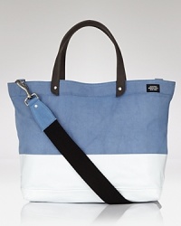 This durable, downtown tote is perfect for everyday use with its modern color block design and reinforced material. This durable, downtown tote is perfect for everyday use with its modern color block design and reinforced material.
