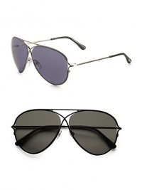 Classic aviators in lightweight metal with unique criss-cross detail. Available in shiny black frames with smoke green lenses and shiny rhodium frames with blue lenses. 100% UV protective Made in Italy 