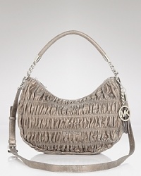 Crafted from quilted leather with a versatile shoulder-to-crossbody silhouette, this luxe style from MICHAEL Michale Kors gets it day-to-night right. Crafted from quilted leather with a versatile shoulder-to-crossbody silhouette, this luxe style from MICHAEL Michale Kors gets it day-to-night right.