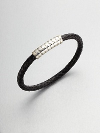 A simple design with modern sensibilities defines this woven leather bracelet, accented by a sterling silver clasp.LeatherSterling silverAbout 3 diam.Made in the United Kingdom A simple design with modern sensibilities defines this woven leather bracelet, accented by a sterling silver clasp.LeatherSterling silverAbout 3 diam.Made in the United Kingdom