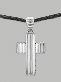 A ridged cross pendant crafted in polished silver hangs from a woven cord of soft leather. From the Bedeg Collection Silver Leather Pendant, 1W X 2¼H Necklace, adjustable 26-28 Lobster clasp Imported A ridged cross pendant crafted in polished silver hangs from a woven cord of soft leather. From the Bedeg Collection Silver Leather Pendant, 1W X 2¼H Necklace, adjustable 26-28 Lobster clasp Imported