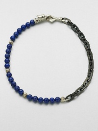 A brilliant strand of smooth lapis beads joins together with intricate links of sterling silver and stainless steel, and is finished with a sculpted sterling silver clasp.LapisSterling silver/stainless steelAbout 3 diam.Imported