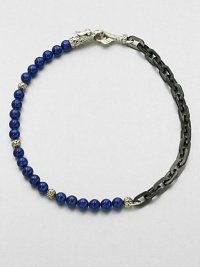 A brilliant strand of smooth lapis beads joins together with intricate links of sterling silver and stainless steel, and is finished with a sculpted sterling silver clasp.LapisSterling silver/stainless steelAbout 3 diam.Imported A brilliant strand of smooth lapis beads joins together with intricate links of sterling silver and stainless steel, and is finished with a sculpted sterling silver clasp.LapisSterling silver/stainless steelAbout 3 diam.Imported