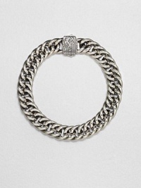 A signature link design of smooth, shiny sterling silver with wave design detail on the clasp.Sterling silverAbout 2 diam.Imported A signature link design of smooth, shiny sterling silver with wave design detail on the clasp.Sterling silverAbout 2 diam.Imported