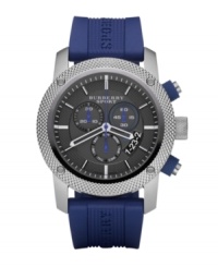 This Burberry timepiece features a blue rubber strap and round stainless steel case. Textured, gray chronograph dial with stick indices, date window at four o'clock, three subdials, logo and white and blue accents. Quartz movement. Water resistant to 100 meters. Two-year limited warranty. This Burberry timepiece features a blue rubber strap and round stainless steel case. Textured, gray chronograph dial with stick indices, date window at four o'clock, three subdials, logo and white and blue accents. Quartz movement. Water resistant to 100 meters. Two-year limited warranty.