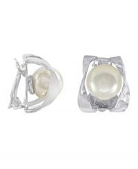 A timeless tradition for style excellence. Majorica earrings feature white, organic, man-made pearls (10 mm) set in a swirling, sterling silver clip on setting. Approximate drop: 1 inch. A timeless tradition for style excellence. Majorica earrings feature white, organic, man-made pearls (10 mm) set in a swirling, sterling silver clip on setting. Approximate drop: 1 inch.