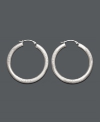 A style staple. Hoop earrings are a must-have for every wardrobe. This classic style comes in 14k white gold with a lever backing. Approximate diameter: 1-1/4 inches. A style staple. Hoop earrings are a must-have for every wardrobe. This classic style comes in 14k white gold with a lever backing. Approximate diameter: 1-1/4 inches.