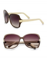 This luxurious resin frame is accented with exotic snakeskin wrapped temples. Available in mocha-cream skin with smoke gradient lens. Snakeskin temples100% UV protectionImported This luxurious resin frame is accented with exotic snakeskin wrapped temples. Available in mocha-cream skin with smoke gradient lens. Snakeskin temples100% UV protectionImported