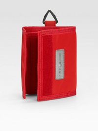 Simply and sporty in durable nylon with a grip-tape closure and handy key ring. Grip-tape closure One bill compartment Card slots Nylon 5 X 4 Imported Simply and sporty in durable nylon with a grip-tape closure and handy key ring. Grip-tape closure One bill compartment Card slots Nylon 5 X 4 Imported