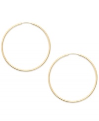Forever stylish, forever chic. This pair of endless hoop earrings comes in 14k gold. Approximate diameter: 35 mm. Forever stylish, forever chic. This pair of endless hoop earrings comes in 14k gold. Approximate diameter: 35 mm.