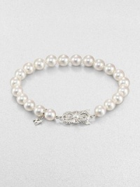 A lustrous strand of cultured pearls accented with a feminine 18k white gold clasp. 7mm-7.5mm round white cultured pearls18k white goldLength, about 7Butterfly closureImported A lustrous strand of cultured pearls accented with a feminine 18k white gold clasp. 7mm-7.5mm round white cultured pearls18k white goldLength, about 7Butterfly closureImported