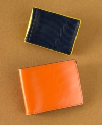 With a sleek style and a pop of color, this wallet from Will Snyder for J. Fold blends modern utility with modern art. With a sleek style and a pop of color, this wallet from Will Snyder for J. Fold blends modern utility with modern art.