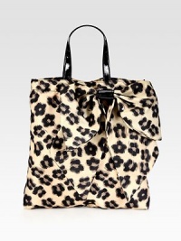 A roomy shape of sturdy nylon in a sexy leopard print, complete with a front bow and patent leather top handles. Double patent leather top handles, 6½ dropMagnetic snap closureOne inside zip pocketCotton lining13½W X 14½H X 1¾DMade in Italy A roomy shape of sturdy nylon in a sexy leopard print, complete with a front bow and patent leather top handles. Double patent leather top handles, 6½ dropMagnetic snap closureOne inside zip pocketCotton lining13½W X 14½H X 1¾DMade in Italy