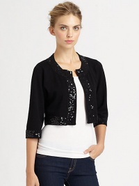 Glimmering sequins lend a glam touch to this boxy knit bolero.Round necklineLong sleevesOpen frontAbout 15 from shoulder to hem80% rayon/20% nylonDry cleanImported Glimmering sequins lend a glam touch to this boxy knit bolero.Round necklineLong sleevesOpen frontAbout 15 from shoulder to hem80% rayon/20% nylonDry cleanImported