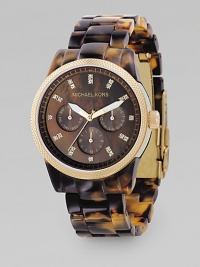 Deep earth tones style this sports watch with stainless steel case and CRYSTALLIZED - Swarovski Elements at each index. Face, about 1½ diameter Tortoise acrylic bracelet Mother-of-pearl dial Knurled bezel Multifunction movement Imported Deep earth tones style this sports watch with stainless steel case and CRYSTALLIZED - Swarovski Elements at each index. Face, about 1½ diameter Tortoise acrylic bracelet Mother-of-pearl dial Knurled bezel Multifunction movement Imported