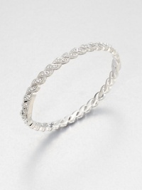 Graceful crystal-set feather shapes come together to form an elegant hinged bangle with shimmer that goes on and on.CrystalRhodium platingDiameter, about 2½Width, about ¼Box-and-tongue claspImported