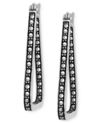 It's what's on the inside, and outside, that counts. Genevieve & Grace takes a dual approach to elegance with its triangular hoop earrings, set in sterling silver with marcasite adding a stylish touch. Approximate drop: 1-1/2 inches. It's what's on the inside, and outside, that counts. Genevieve & Grace takes a dual approach to elegance with its triangular hoop earrings, set in sterling silver with marcasite adding a stylish touch. Approximate drop: 1-1/2 inches.