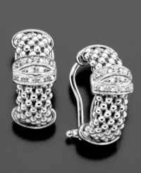 These sophisticated lever-back earrings feature clusters of sparkling diamonds (1/5 ct. t.w.) amidst a unique sterling silver setting. Approximate drop: 3/4 inch. These sophisticated lever-back earrings feature clusters of sparkling diamonds (1/5 ct. t.w.) amidst a unique sterling silver setting. Approximate drop: 3/4 inch.