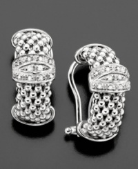 These sophisticated lever-back earrings feature clusters of sparkling diamonds (1/5 ct. t.w.) amidst a unique sterling silver setting. Approximate drop: 3/4 inch.