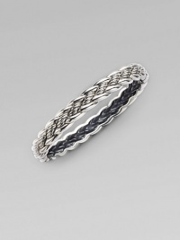 From the Woven Cable Collection. An elegant braid of sterling silver weaves textured and smooth strands into a sophisticated bangle. Sterling silver Diameter, about 2¼ Width, about ¼ Imported