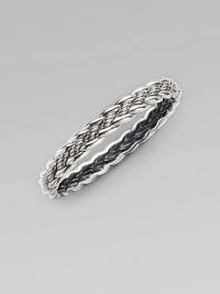 From the Woven Cable Collection. An elegant braid of sterling silver weaves textured and smooth strands into a sophisticated bangle. Sterling silver Diameter, about 2¼ Width, about ¼ Imported From the Woven Cable Collection. An elegant braid of sterling silver weaves textured and smooth strands into a sophisticated bangle. Sterling silver Diameter, about 2¼ Width, about ¼ Imported