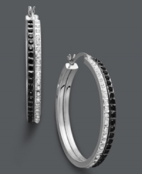 Two rows of subtle, contrasting sparkle make a huge impact on traditional hoop earrings. Crafted in sterling silver, these sweetly shimmering hoops feature round-cut white and black diamond accents. Approximate diameter: 1-1/4 inches. Two rows of subtle, contrasting sparkle make a huge impact on traditional hoop earrings. Crafted in sterling silver, these sweetly shimmering hoops feature round-cut white and black diamond accents. Approximate diameter: 1-1/4 inches.