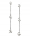 Elongated grace. Cultured freshwater pearls (4-8 mm) are arranged across a sterling silver chain to create a sophisticated set of long drop earrings. Approximate drop: 2 inches.