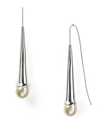 Delicate faux pearls drop from luminous silver plated metal on this pair of Robert Lee Morris elongated French wire earrings. Delicate faux pearls drop from luminous silver plated metal on this pair of Robert Lee Morris elongated French wire earrings.