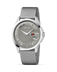 A diamante embossed face on a steel mesh strap lends Gucci's signature look to this versatile, timeless wristwatch. A diamante embossed face on a steel mesh strap lends Gucci's signature look to this versatile, timeless wristwatch.