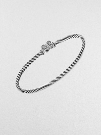 From the Cable Collectible Collection. This sweet style features a pretty butterfly with an diamond accented thorax on an iconic cable bangle. Sterling silverDiamonds, .02 tcwDiameter, about 2½Slip-on styleImported From the Cable Collectible Collection. This sweet style features a pretty butterfly with an diamond accented thorax on an iconic cable bangle. Sterling silverDiamonds, .02 tcwDiameter, about 2½Slip-on styleImported