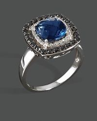 Black and white diamonds frame a checkerboard London blue topaz, set in 14K white gold. Black and white diamonds frame a checkerboard London blue topaz, set in 14K white gold.