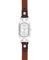 Petite with subtle elegance, by Nine West. Watch crafted of brown leather strap and oval silver tone mixed metal case. Silver tone dial features tonal applied stick indices, numerals at twelve and six o'clock, silver tone hour and minute hands, sweeping second hand and logo at six o'clock. Quartz movement. Limited lifetime warranty. Petite with subtle elegance, by Nine West. Watch crafted of brown leather strap and oval silver tone mixed metal case. Silver tone dial features tonal applied stick indices, numerals at twelve and six o'clock, silver tone hour and minute hands, sweeping second hand and logo at six o'clock. Quartz movement. Limited lifetime warranty.