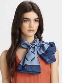 An elegant design with interlocking G's, bows and a solid border, hand-finished on luxe silk twill.Silk twillAbout 35 X 35Dry cleanMade in Italy An elegant design with interlocking G's, bows and a solid border, hand-finished on luxe silk twill.Silk twillAbout 35 X 35Dry cleanMade in Italy