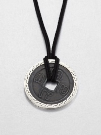 From the Classic Chain Collection. The center of this striking pendant has the look of an ancient coin with its square hole and blackened finish, set in a distinctive carved setting of polished sterling silver and hanging from a black cord.Sterling silverBlack fabric cordCord length, about 22 to 24 (adjustable)Pendant diameter, about 1.75Lobster claspMade in Bali