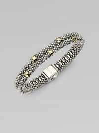 Beautifully textured sterling silver with radiant 18k gold accents in a stunning double row design. Sterling silver18k goldDiameter, about 2¼Box clasp closureImported 